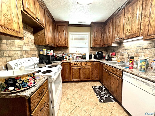 kitchen featuring tasteful backsplash, a textured ceiling, crown molding, white appliances, and sink