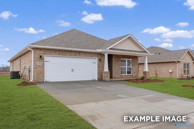 craftsman house with central AC unit, a garage, and a front lawn