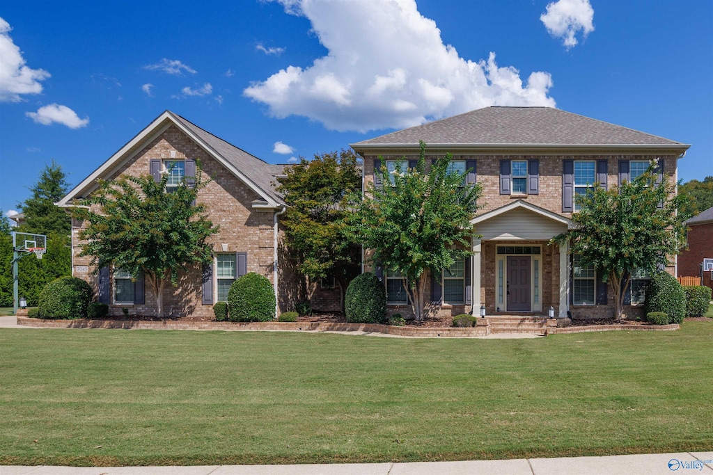 view of front of house with a front lawn and a porch