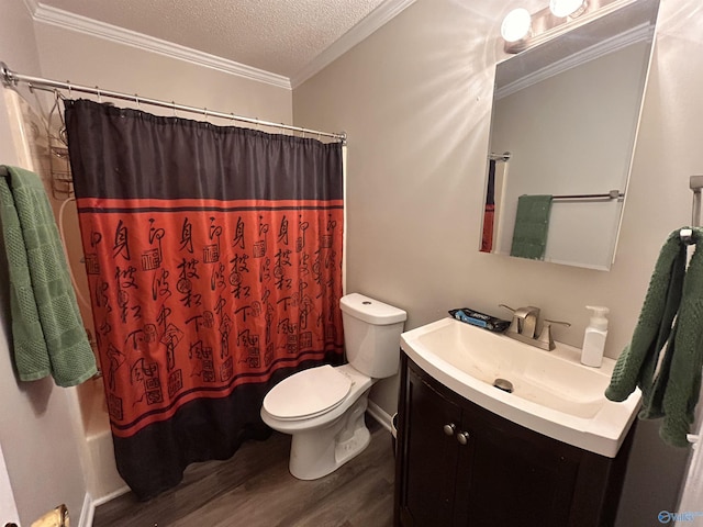 2103 Orba Dr, Huntsville, AL 35811 - bathroom featuring crown molding, vanity, toilet, a textured ceiling, and wood finished floors