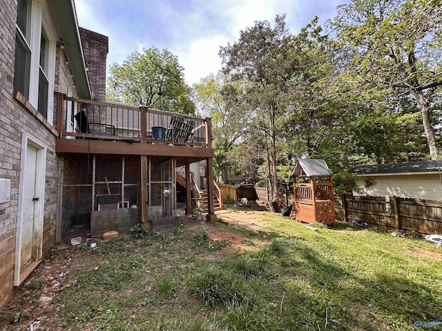 2103 Orba Dr, Huntsville, AL 35811 - view of yard featuring a wooden deck, a fenced backyard, a playground, and stairs