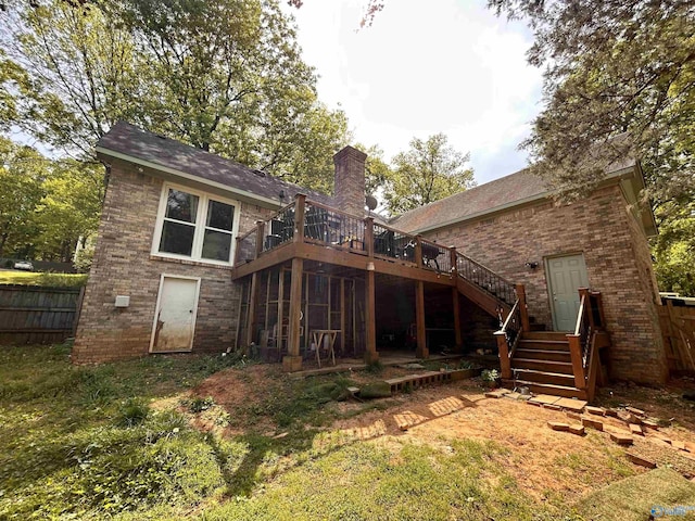 2103 Orba Dr, Huntsville, AL 35811 - rear view of house with fence, stairs, brick siding, a deck, and a chimney