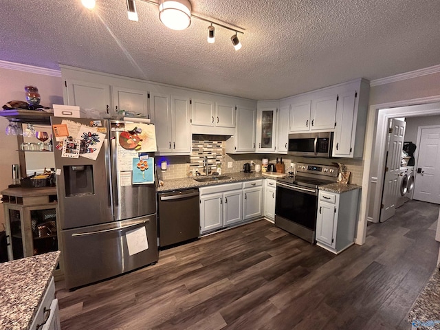 2103 Orba Dr, Huntsville, AL 35811 - kitchen with crown molding, stainless steel appliances, a sink, and washing machine and clothes dryer