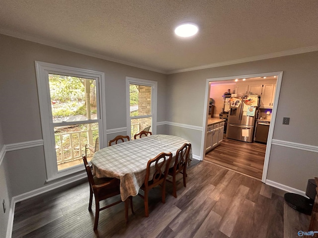 2103 Orba Dr, Huntsville, AL 35811 - dining area with crown molding, baseboards, dark wood-style flooring, and a textured ceiling