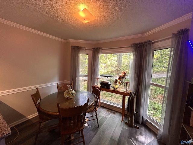 2103 Orba Dr, Huntsville, AL 35811 - dining area featuring visible vents, ornamental molding, a textured ceiling, and dark wood-style floors