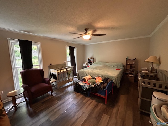 2103 Orba Dr, Huntsville, AL 35811 - bedroom with crown molding, a textured ceiling, a ceiling fan, and wood finished floors