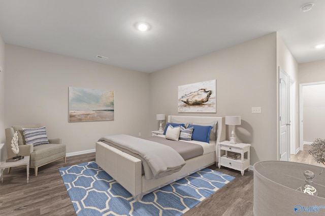 bedroom featuring recessed lighting, wood finished floors, and baseboards