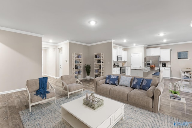 living room featuring recessed lighting, wood finished floors, and baseboards