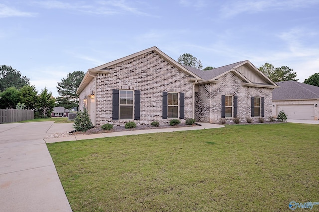 view of front of property with cooling unit, concrete driveway, an attached garage, a front yard, and brick siding