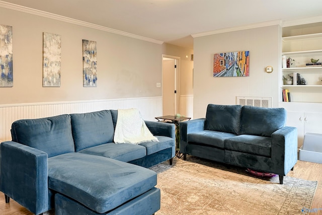 living room with crown molding and light wood-type flooring