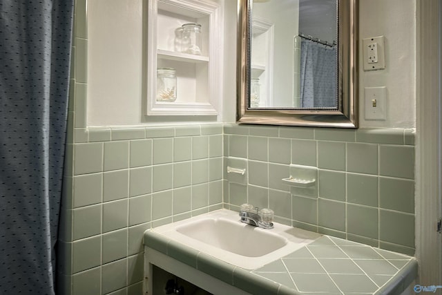 bathroom with tile walls and vanity