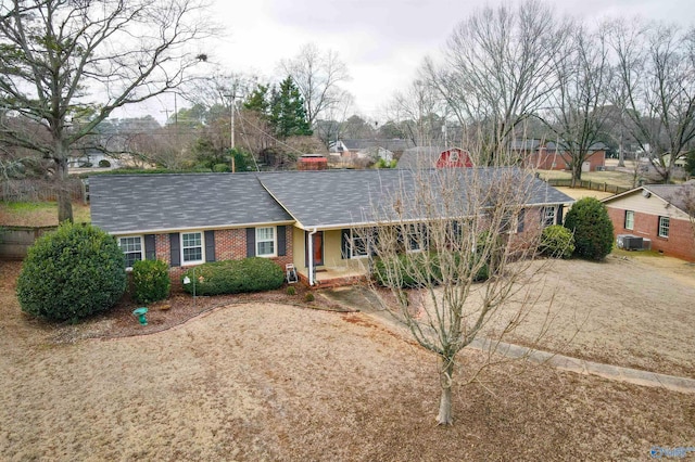 ranch-style home featuring central air condition unit