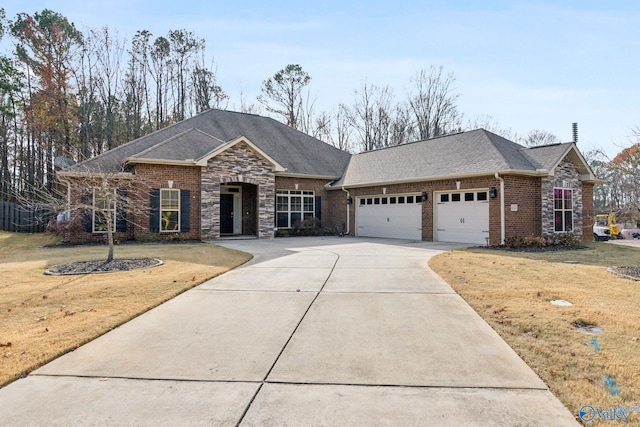 ranch-style home featuring a front lawn and a garage