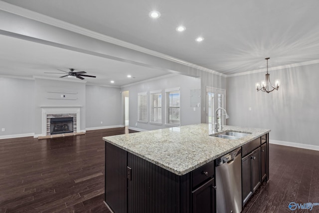 kitchen with dishwasher, sink, dark hardwood / wood-style floors, an island with sink, and pendant lighting