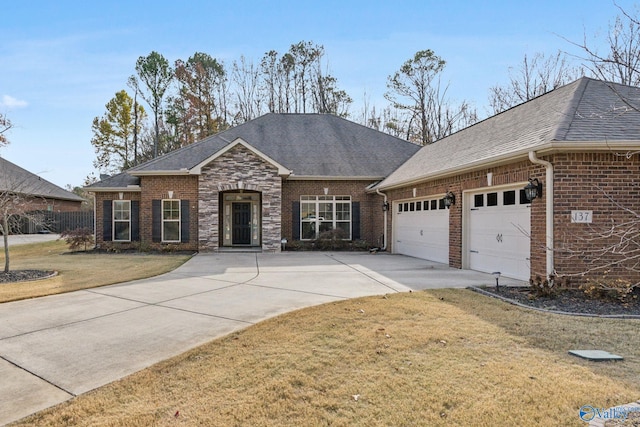 ranch-style home featuring a front yard and a garage