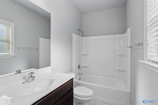 full bathroom featuring tile patterned flooring, vanity,  shower combination, and toilet