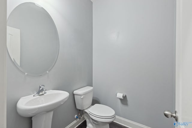 bathroom with toilet and sink