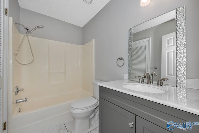 full bathroom featuring vanity,  shower combination, toilet, and a textured ceiling