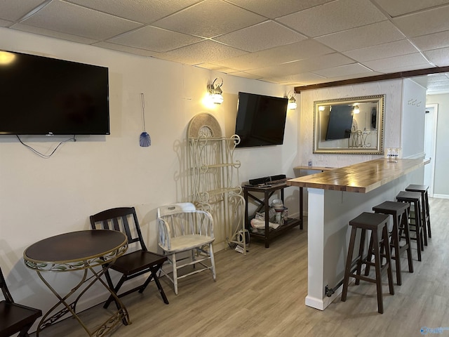 600 County Road 531 Unit 209, Centre, AL 35960 - bar with light wood-type flooring, baseboards, and a paneled ceiling