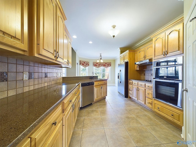 kitchen with pendant lighting, sink, stainless steel appliances, backsplash, and crown molding