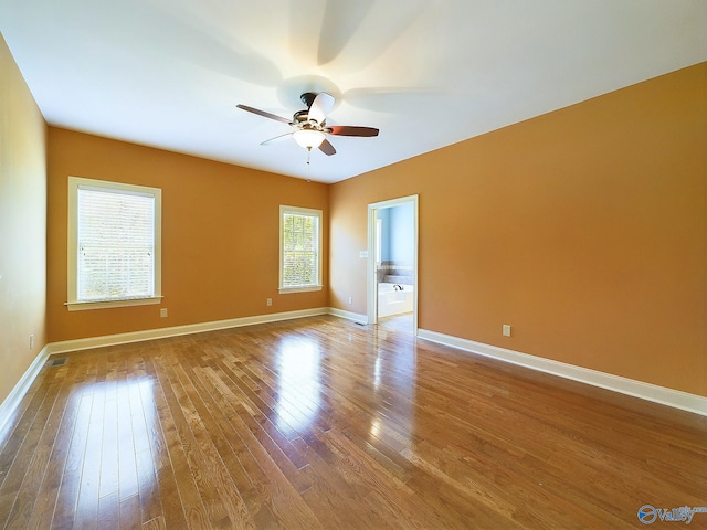 spare room featuring ceiling fan and light hardwood / wood-style flooring