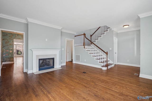 unfurnished living room with ornamental molding and dark hardwood / wood-style flooring