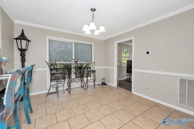 dining area featuring a notable chandelier and ornamental molding