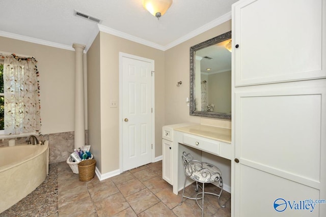 bathroom with vanity, crown molding, ornate columns, and a washtub