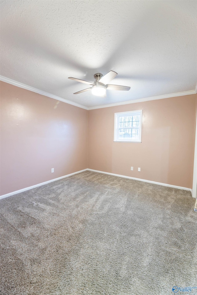 spare room featuring a textured ceiling, a ceiling fan, crown molding, and carpet flooring