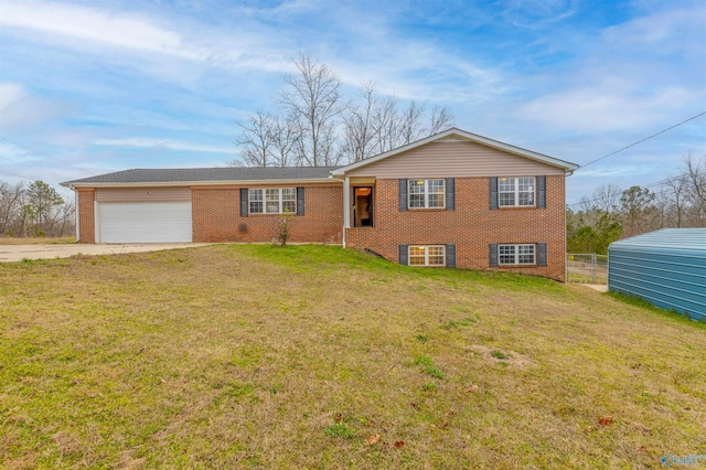 view of front of house featuring brick siding, concrete driveway, fence, a garage, and a front lawn