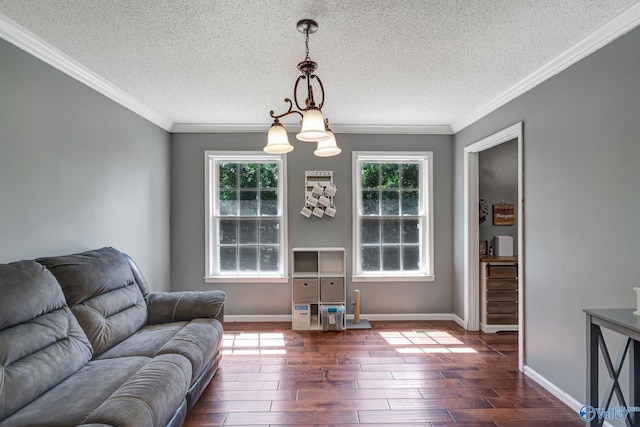 living room with ornamental molding, a textured ceiling, and hardwood / wood-style floors