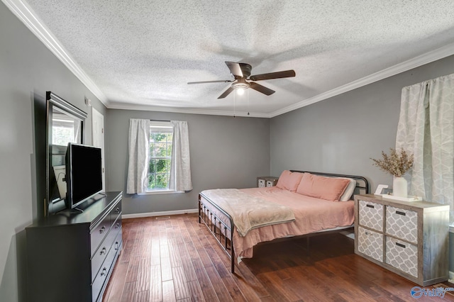 bedroom featuring ornamental molding, ceiling fan, and hardwood / wood-style floors