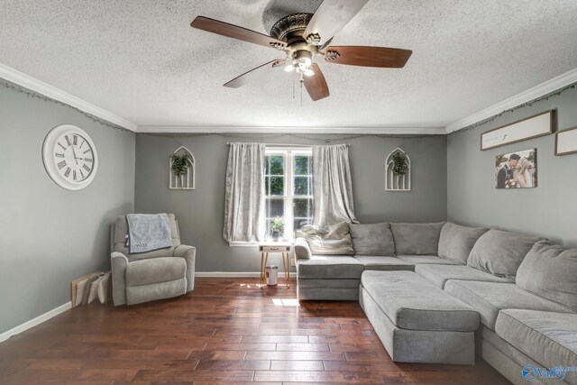 living room with hardwood / wood-style flooring, a textured ceiling, ornamental molding, and ceiling fan