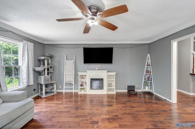 living room with ceiling fan, ornamental molding, hardwood / wood-style floors, and plenty of natural light