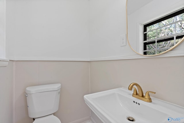 bathroom featuring sink and toilet