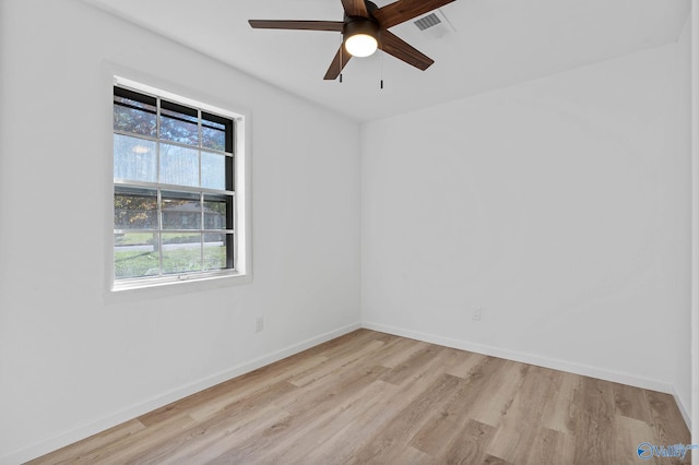 spare room featuring ceiling fan and light hardwood / wood-style flooring