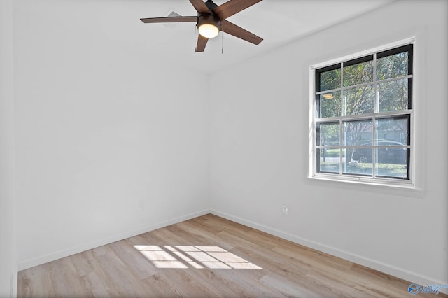 empty room with light hardwood / wood-style floors and ceiling fan