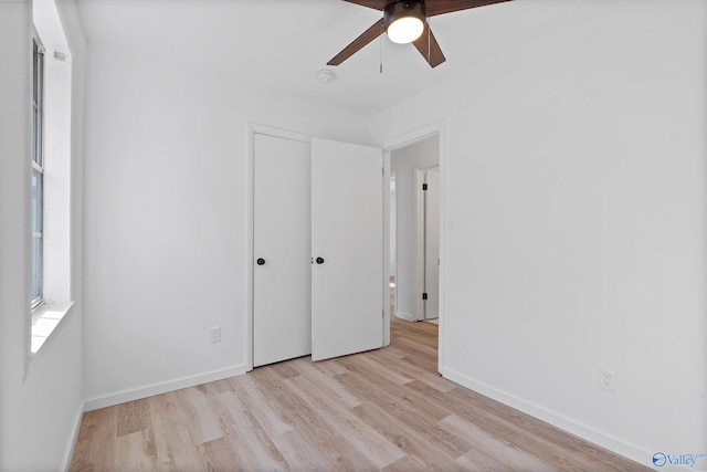 unfurnished bedroom featuring ceiling fan and light hardwood / wood-style flooring