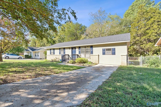 ranch-style home with a front lawn