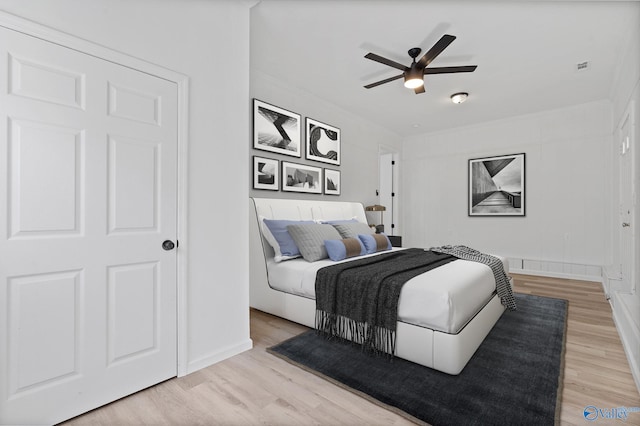 bedroom featuring ceiling fan and light hardwood / wood-style floors