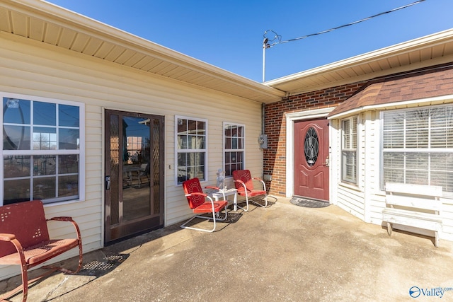 entrance to property with a patio area