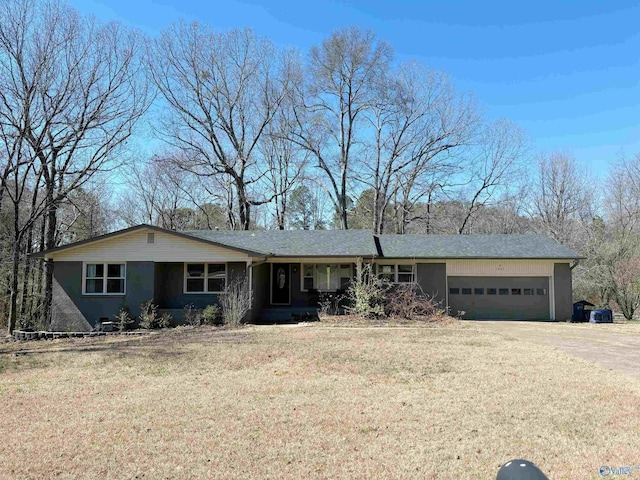 single story home featuring dirt driveway, a front lawn, and a garage