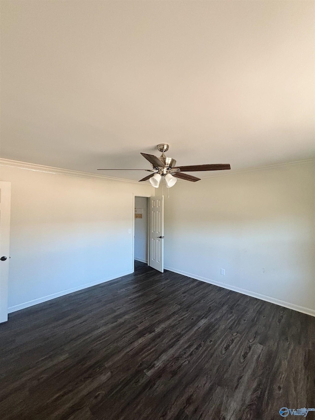 spare room with ornamental molding, baseboards, a ceiling fan, and dark wood-style flooring