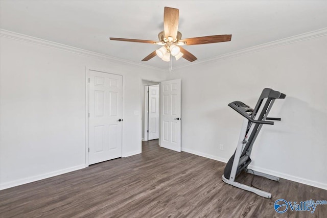 workout room with a ceiling fan, crown molding, baseboards, and wood finished floors