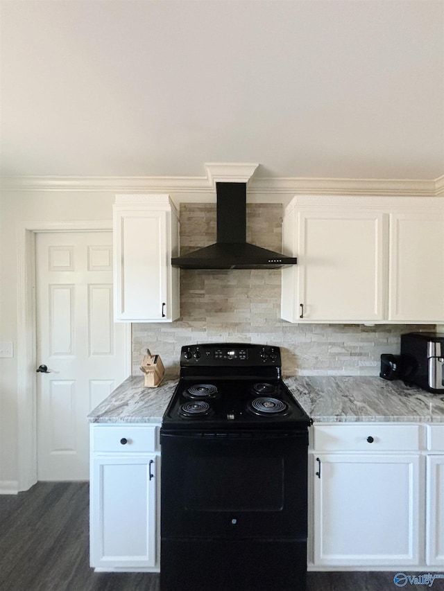 kitchen featuring backsplash, electric range, wall chimney exhaust hood, and white cabinets