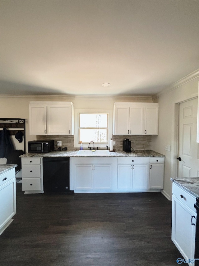 kitchen featuring tasteful backsplash, black appliances, crown molding, white cabinetry, and a sink