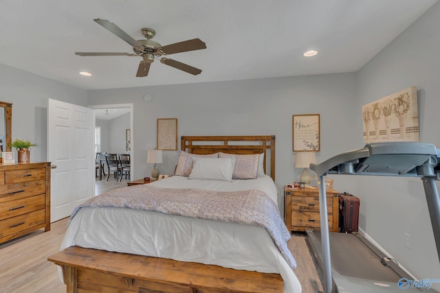 bedroom with ceiling fan and light hardwood / wood-style flooring