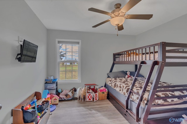 bedroom with ceiling fan and light hardwood / wood-style flooring