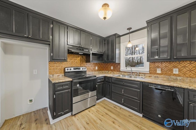 kitchen with light wood-style flooring, a sink, under cabinet range hood, stainless steel electric stove, and dishwasher