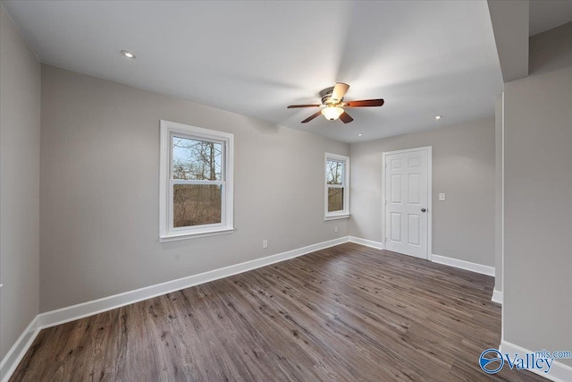 unfurnished room with recessed lighting, baseboards, dark wood-style flooring, and a ceiling fan